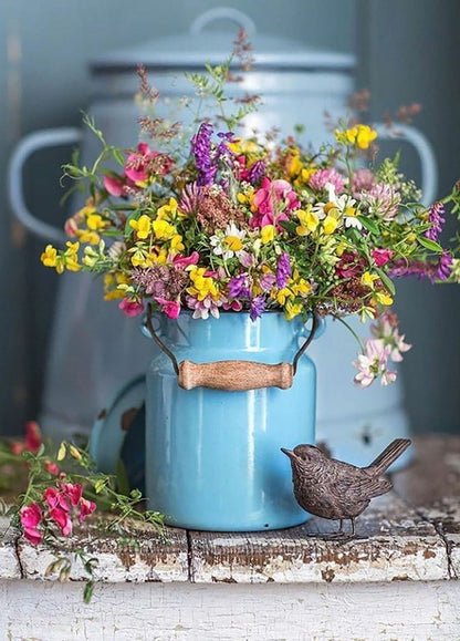 can with flowers and a bird photo postcard