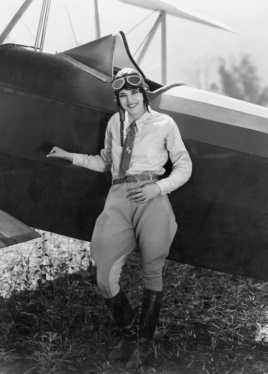 Retro postcard featuring a female pilot