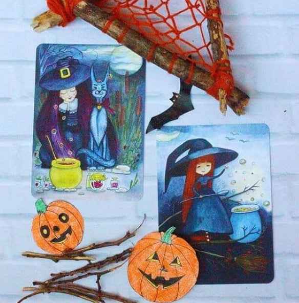 Postcard "Witch, cat and purple berries"